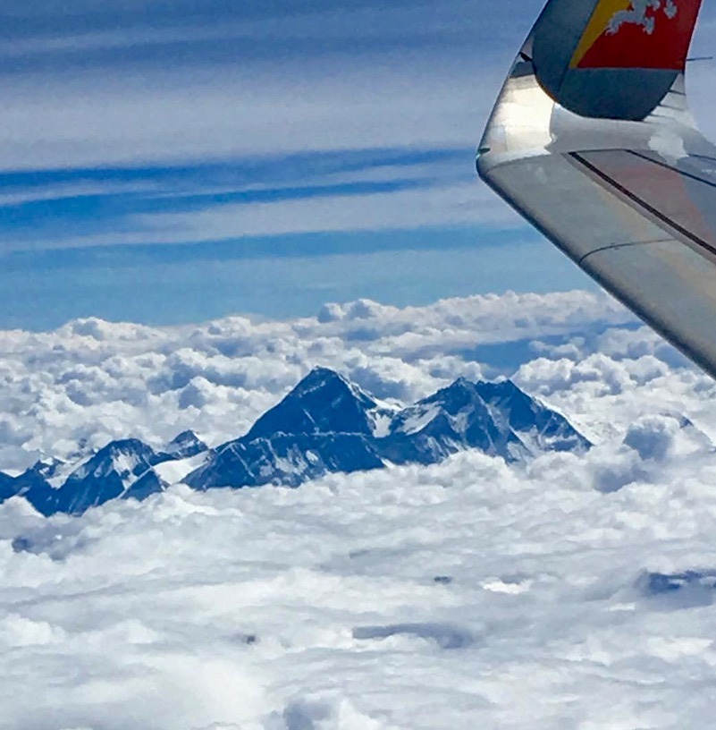 best place to see mount everest poking through the clouds en route to Paro