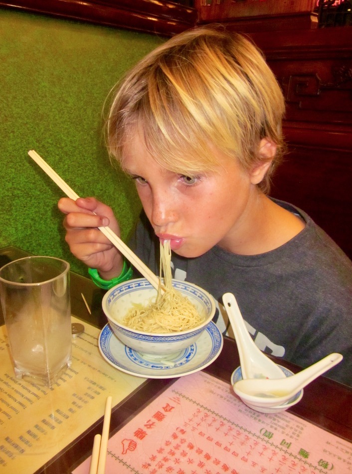 eating noodles in hong kong travel with kids - top ten travel tips