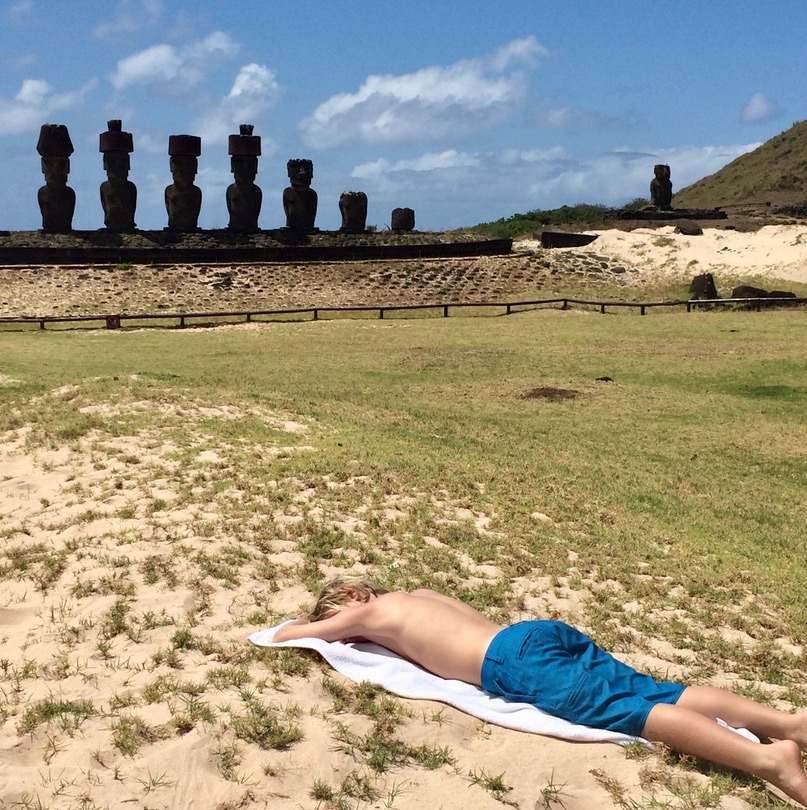 kids on anakena beach visiting the moai statues on easter island anakena