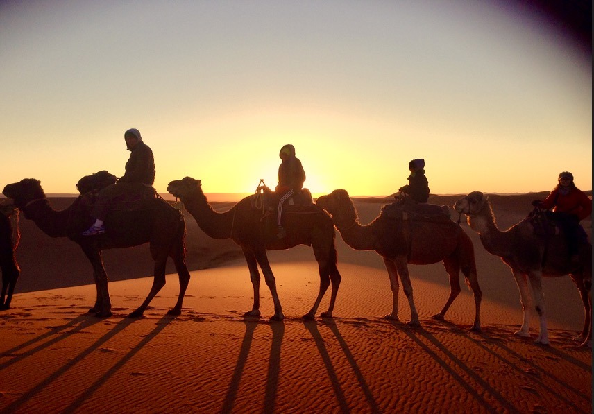family on camels sahara desert, Morocco