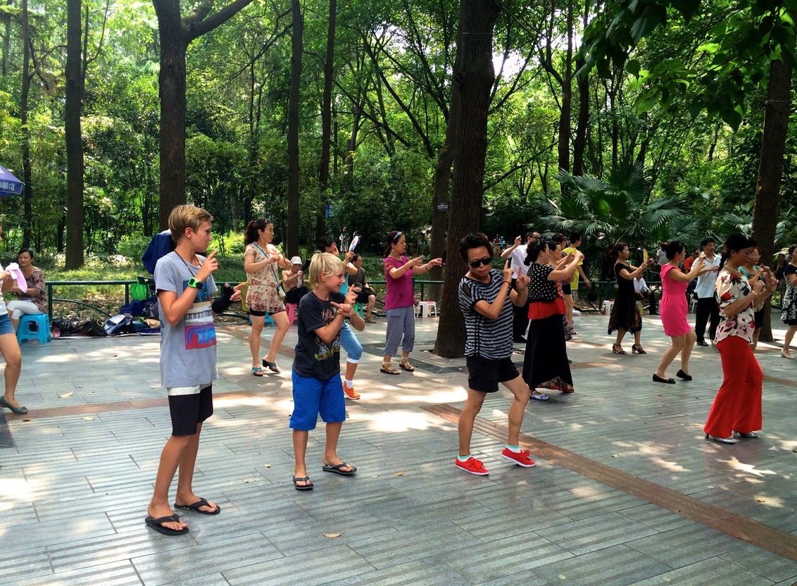 People's Park in Chengdu, China. Line dancing for the kids.