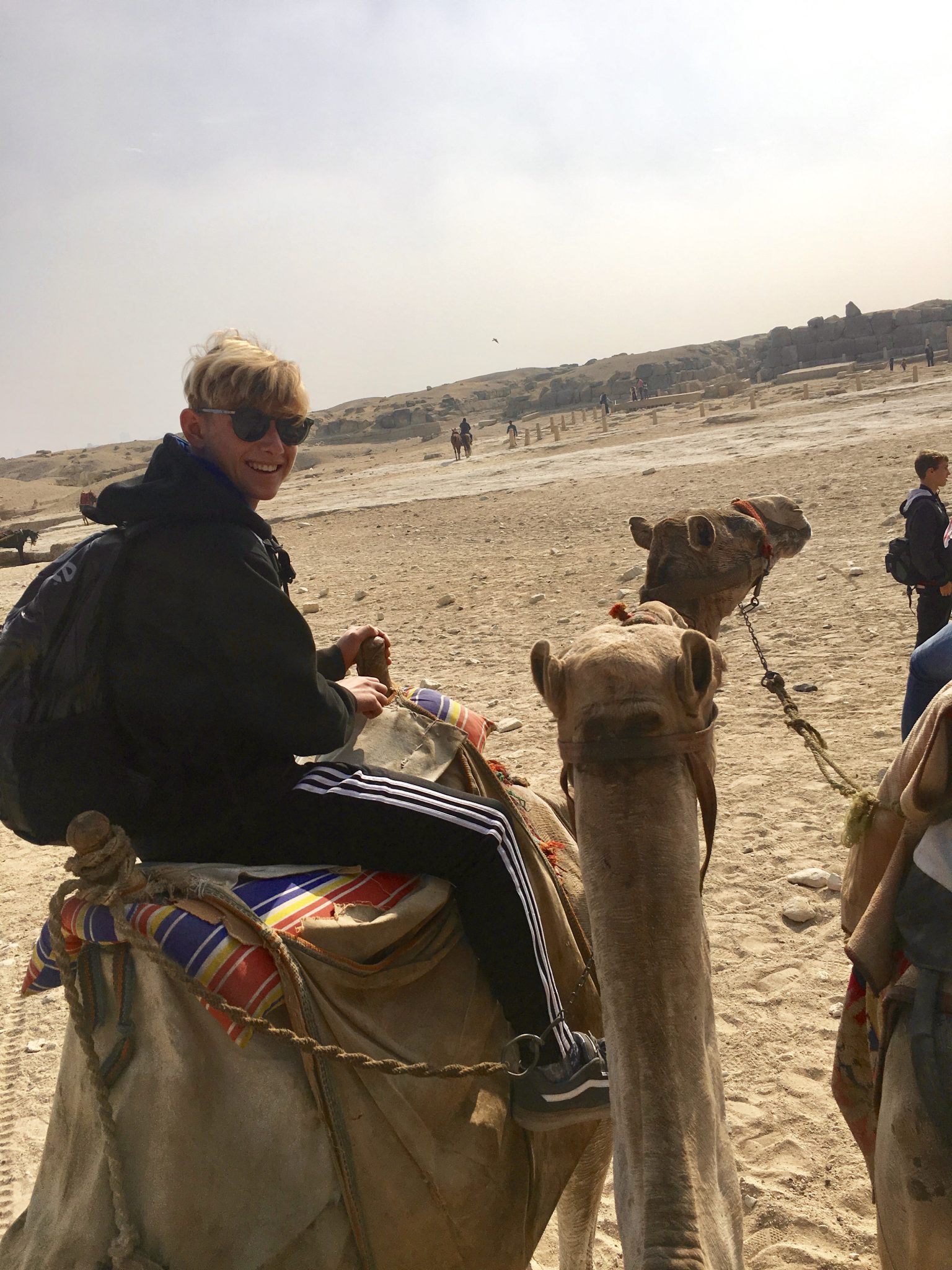 pyramids of giza on camels in cairo