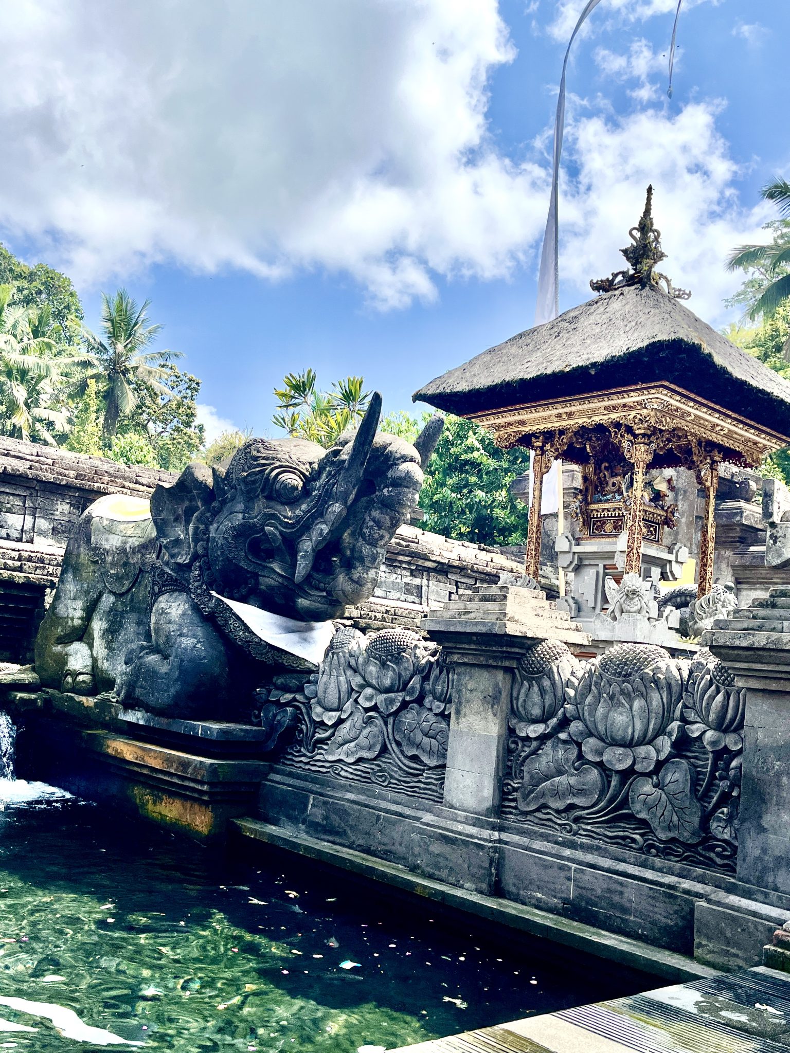 why should you visit pura titra temple in ubud
